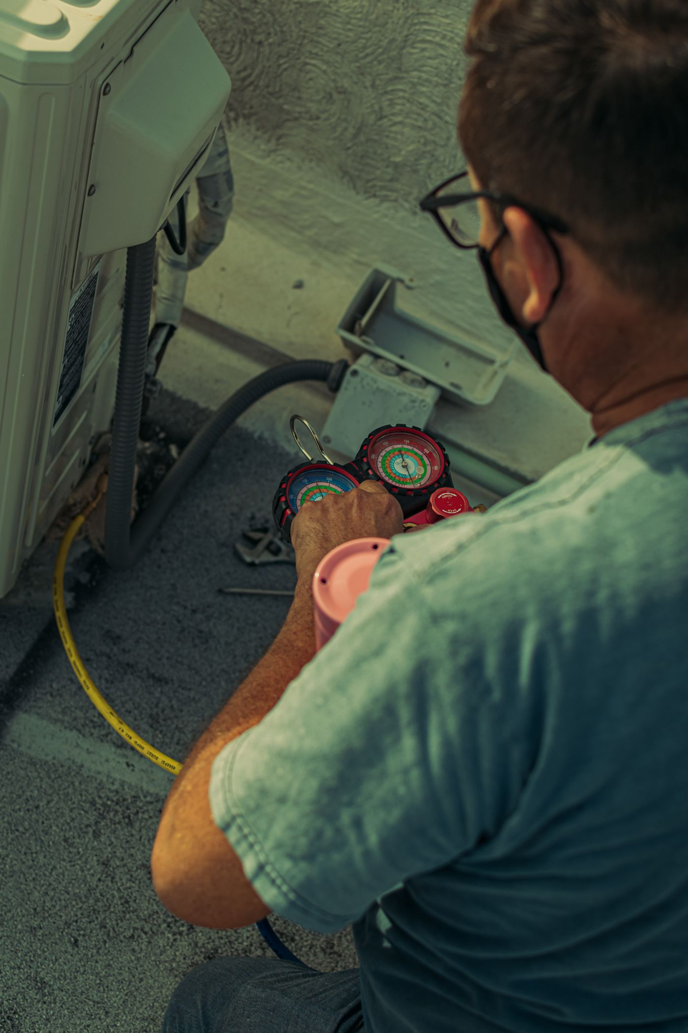 Stock technician checking HVAC equipment outdoors